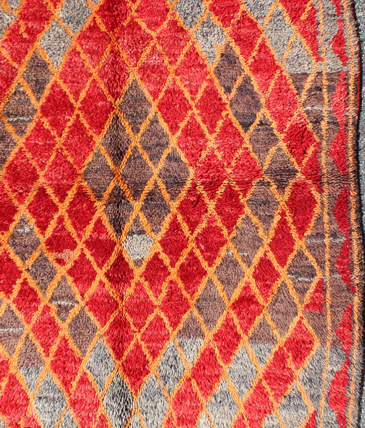 Midcentury Moroccan rug with orange, red, brown diamonds and blue fringe detail. Keivan Woven Arts / rug sk - 628, country of origin / type: Morocco / Tribal, circa mid - 20th century This wonderful vintage Moroccan rug (circa mid - 20th century) feat... - Keivan Woven ArtsSK - 628 - 4078Rug
