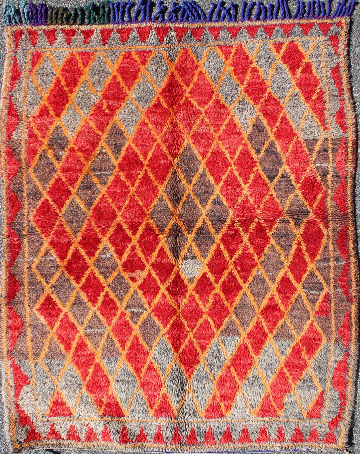Midcentury Moroccan rug with orange, red, brown diamonds and blue fringe detail. Keivan Woven Arts / rug sk - 628, country of origin / type: Morocco / Tribal, circa mid - 20th century This wonderful vintage Moroccan rug (circa mid - 20th century) feat... - Keivan Woven ArtsSK - 628 - 4078Rug