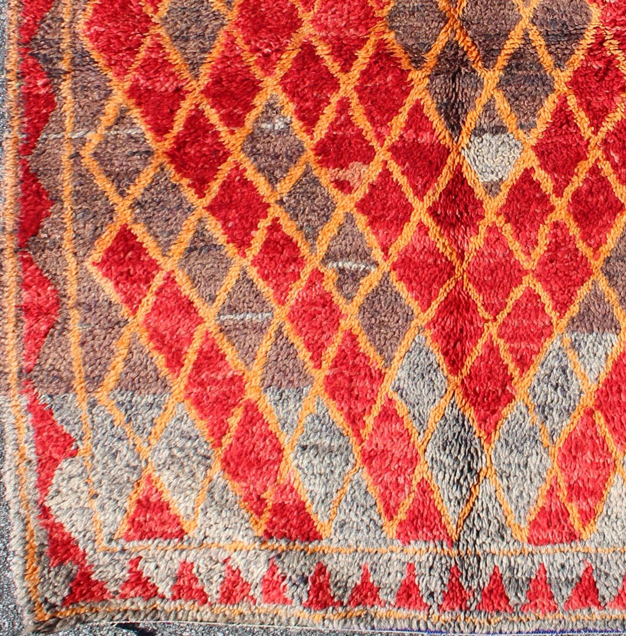 Midcentury Moroccan rug with orange, red, brown diamonds and blue fringe detail. Keivan Woven Arts / rug sk - 628, country of origin / type: Morocco / Tribal, circa mid - 20th century This wonderful vintage Moroccan rug (circa mid - 20th century) feat... - Keivan Woven ArtsSK - 628 - 4078Rug