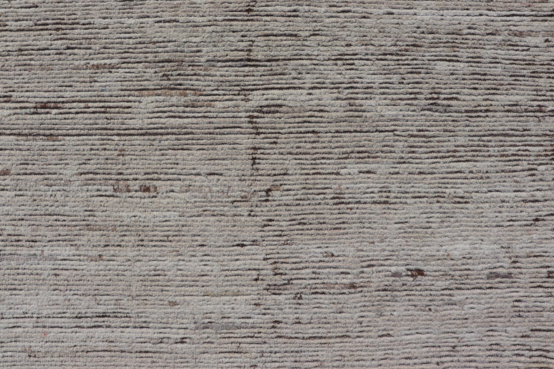 Minimalist Modern with Solid Off White Background in Textures Wool. As part of our modern casual collection, this distressed modern rug with Solid design is inspired by Moroccan rugs. The textured pile is white and off white wool and underneath the ... - Keivan Woven ArtsSNK - 1359 - 21505Rug