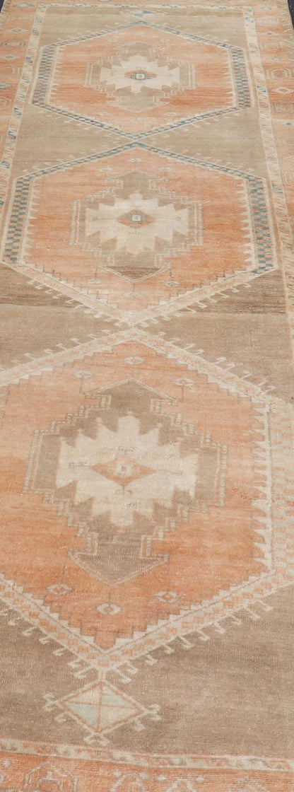 Measures: 3'6 x 13'0 Keivan Woven Arts Oushak Runner With Tribal and Geometric Motifs. Keivan Woven Arts / rug/SNK - 300, country of origin / type: Turkey / Oushak, circa 1940 This vintage runner features an assortment of tribal and geometric meda... - Keivan Woven ArtsSNK - 300 - 27658Rug