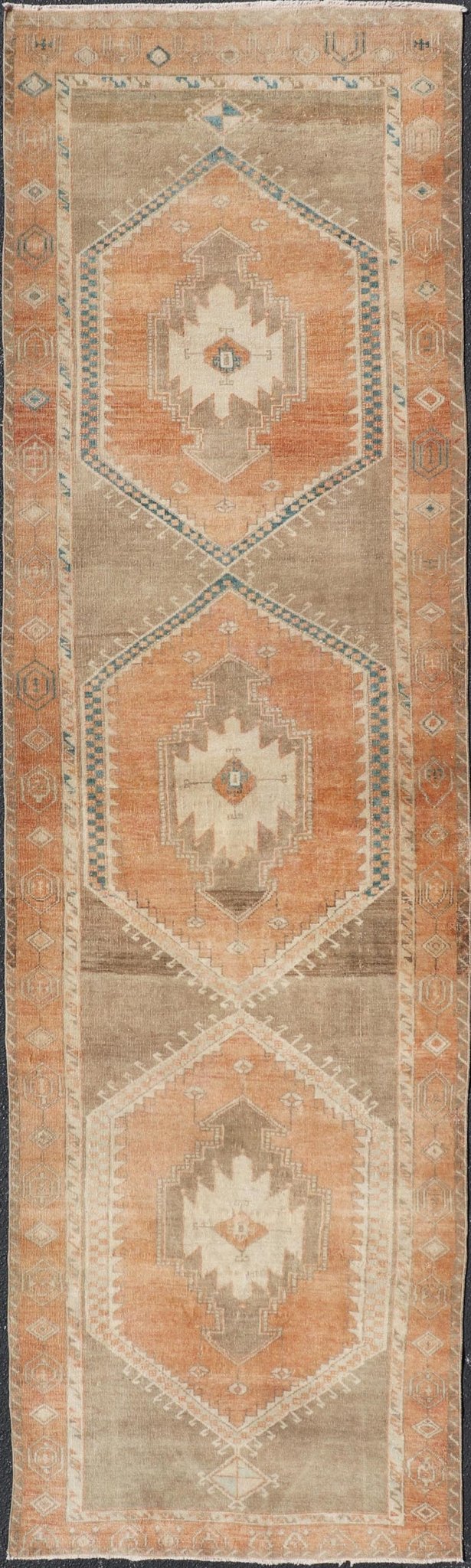 Measures: 3'6 x 13'0 Keivan Woven Arts Oushak Runner With Tribal and Geometric Motifs. Keivan Woven Arts / rug/SNK - 300, country of origin / type: Turkey / Oushak, circa 1940 This vintage runner features an assortment of tribal and geometric meda... - Keivan Woven ArtsSNK - 300 - 27658Rug