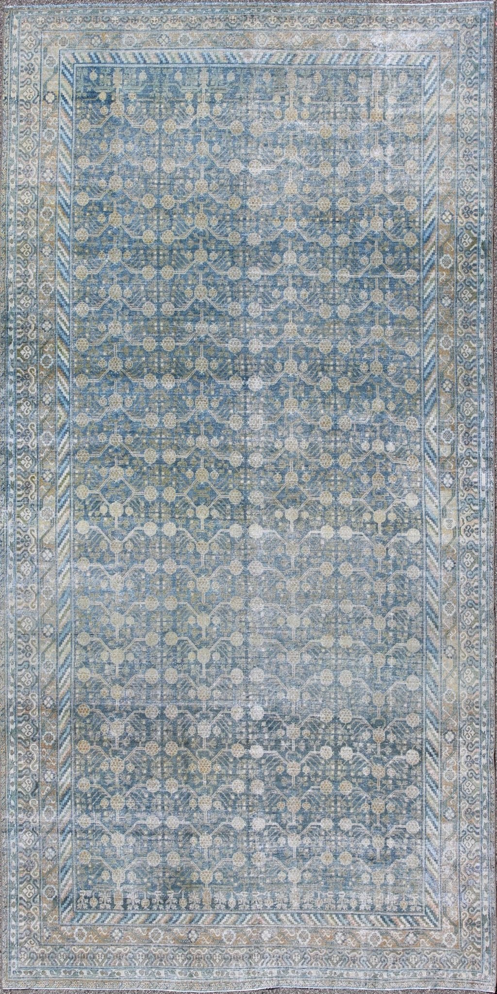 Antique Khotan rug with blue all - over design of blossoms and flowers, large Khotan from Turkestan rug sus - 1803 - 387, country of origin / type: Turkestan / Khotan, circa 1910 This attractive antique Khotan rug (circa 1910) is a spectacular testame... - Keivan Woven ArtsSUS - 1803 - 387 - 9639Rug