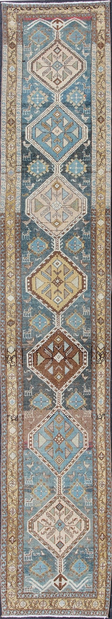 Persian Heriz antique Gallery rug with sub - geometric Medallion Design in colorful tones including blue, nude, and brown, rug sus - 1807 - 215, country of origin / type: Iran / Heriz, circa 1920 This antique Persian Heriz runner, from northwest Iran,... - Keivan Woven ArtsSUS - 1807 - 215 - 10120