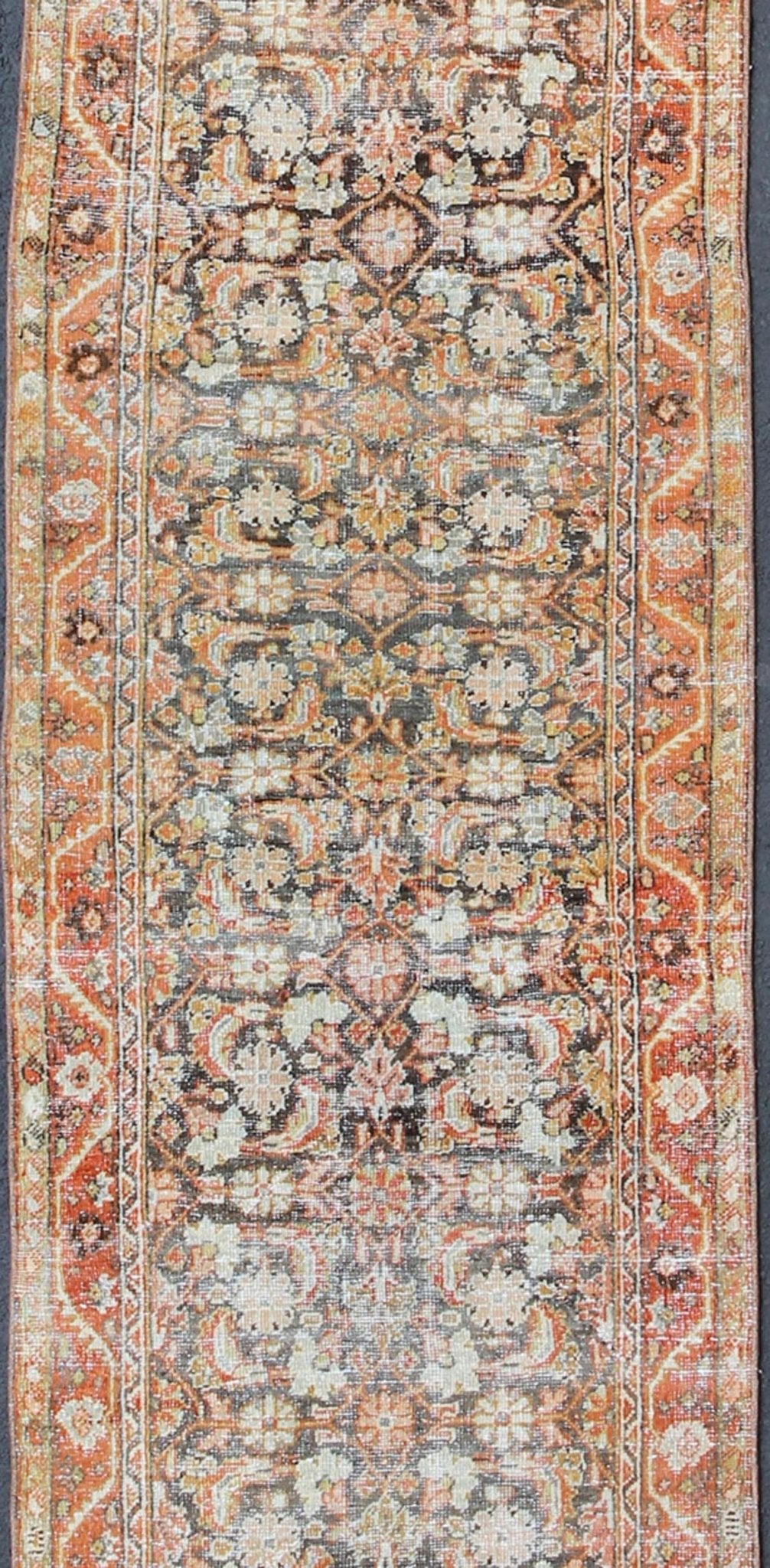All - over floral blossom design long Mahal runner antique from Persia in charcoal and red tones, rug sus - 1807 - 287, country of origin / type: Iran / Mahal, circa 1920. This antique Persian Mahal runner, circa early 20th century, relies heavily on ... - Keivan Woven ArtsSUS - 1807 - 287 - 10157Rug