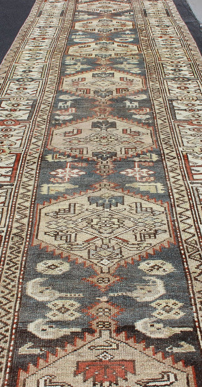 Long Persian Kurdish Runner with Medallion Design in Charcoal, Ivory and Red Antique Persian Kurdish long runner with tribal medallions, rug SUS - 1908 - 115, country of origin / type: Iran or Kurdish, circa 1900. Long Persian Kurdish runner in char... - Keivan Woven ArtsSUS - 1908 - 115 - 11529Rug