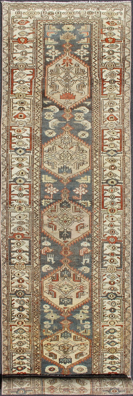 Long Persian Kurdish Runner with Medallion Design in Charcoal, Ivory and Red Antique Persian Kurdish long runner with tribal medallions, rug SUS - 1908 - 115, country of origin / type: Iran or Kurdish, circa 1900. Long Persian Kurdish runner in char... - Keivan Woven ArtsSUS - 1908 - 115 - 11529Rug