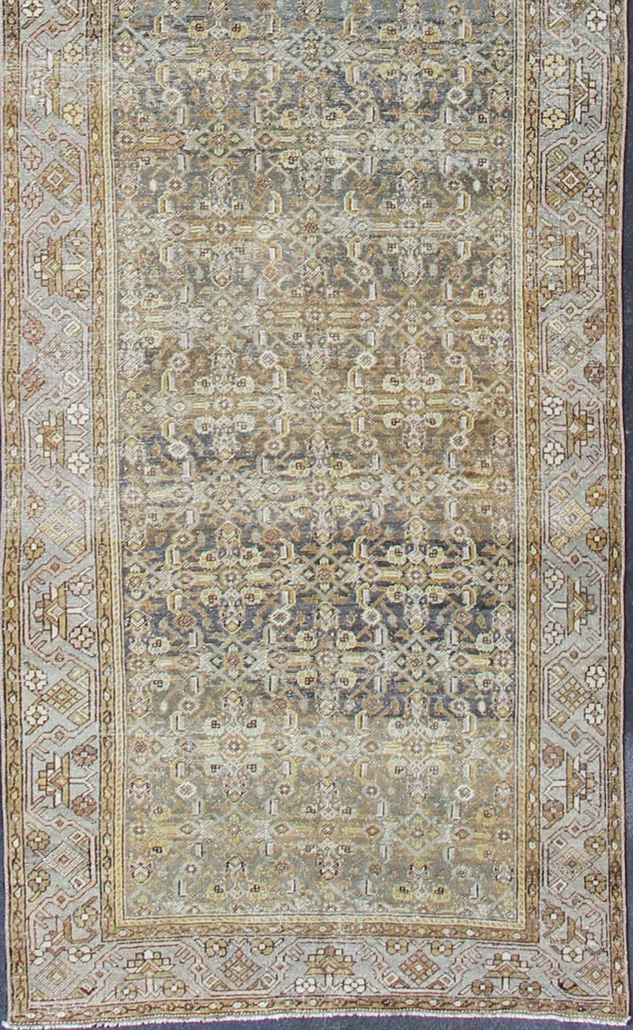 Wide and Long Antique Persian Malayer Runner with All - Over Design in Dark Gray. Rare Persian Malayer Antique wide runner with all - over Herati design in dark gray background and variation of blue, yellow green, light gray, soft yellow, rug SUS - 2007 - ... - Keivan Woven ArtsSUS - 2007 - 38 - 13056