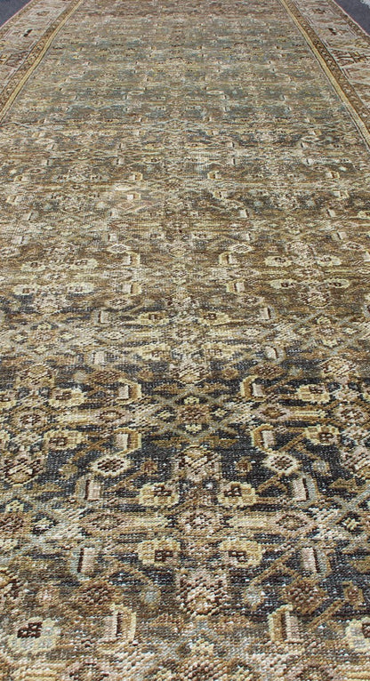 Wide and Long Antique Persian Malayer Runner with All - Over Design in Dark Gray. Rare Persian Malayer Antique wide runner with all - over Herati design in dark gray background and variation of blue, yellow green, light gray, soft yellow, rug SUS - 2007 - ... - Keivan Woven ArtsSUS - 2007 - 38 - 13056