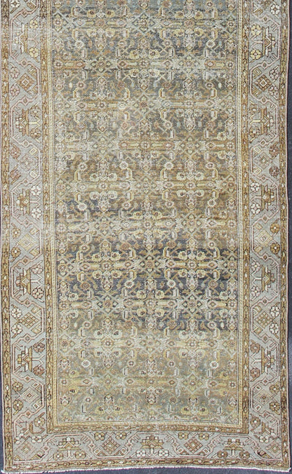 Wide and Long Antique Persian Malayer Runner with All - Over Design in Dark Gray. Rare Persian Malayer Antique wide runner with all - over Herati design in dark gray background and variation of blue, yellow green, light gray, soft yellow, rug SUS - 2007 - ... - Keivan Woven ArtsSUS - 2007 - 38 - 13056Rug