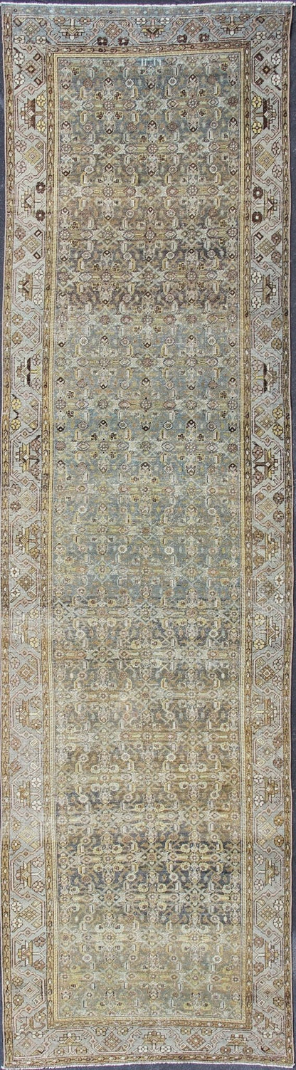 Wide and Long Antique Persian Malayer Runner with All - Over Design in Dark Gray. Rare Persian Malayer Antique wide runner with all - over Herati design in dark gray background and variation of blue, yellow green, light gray, soft yellow, rug SUS - 2007 - ... - Keivan Woven ArtsSUS - 2007 - 38 - 13056