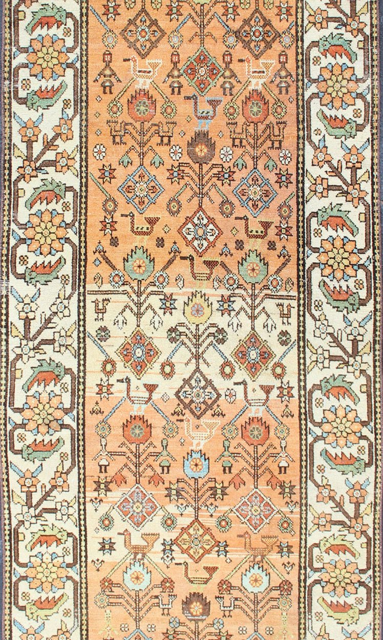Salmon Background and Earth Tone Antique Bakitari Rug with All - Over Patten All - over Persian with salmon and soft orange Bakitari rug Sub Floral design Bakitari antique rug in light orange/Salmon color tones, rug SUS - 2009 - 652, origin / type: I... - Keivan Woven ArtsSUS - 2009 - 652 - 13276Rug