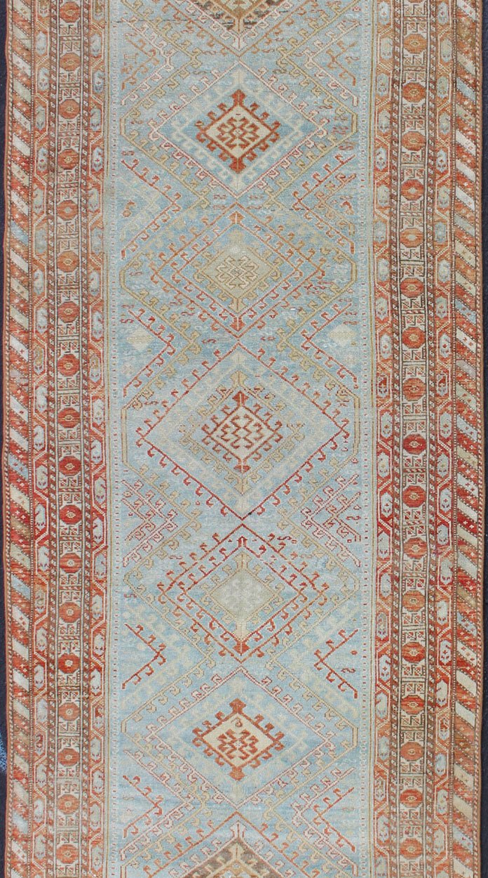 Light Blue and Soft Range Antique Persian Malayer Runner with Geometric Motifs Tribal design Persian antique Malayer runner in blue, red, orange, rug SUS - 2009 - 658, country of origin / type: Iran / Mahal, circa 1920 This antique Persian Ma... - Keivan Woven ArtsSUS - 2009 - 658 - 13314