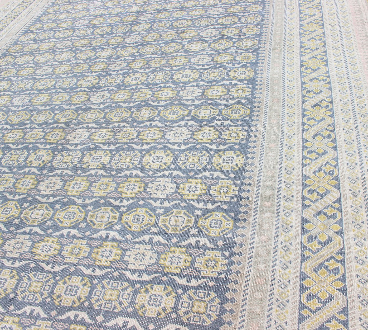 Antique Khotan Rug in Shades of Blue with Gray, L. Pink and Yellow Accents Antique Khotan rug in shades of blue, Taupe, gray, pink, and yellow, rug SUS - 2009 - 75, country of origin / type: Turkestan / Khotan, 1930 This attractive Khotan rug... - Keivan Woven ArtsSUS - 2009 - 75 - 13326