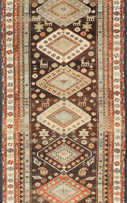 Long Persian Kurdish Runner with Medallion Design in Brown, Orange and Cream Antique Persian Kurdish long runner with tribal medallions, Keivan Woven Arts rug/SUS - 1908 - 115, country of origin / type: Iran or Kurdish, circa 1910. Long Persian Ku... - Keivan Woven ArtsSUS - 2012 - 660 - 14278Rug