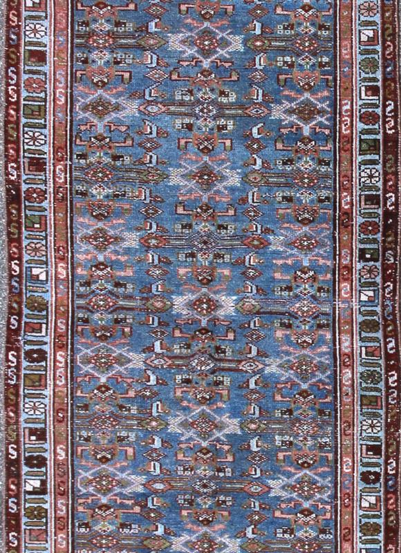Early 20th Century Long Kurdish Runner with Blue, Red, Green and Salmon Pink kwarugs This antique Kurdish tribal runner was woven by Kurdish weavers in western Persia in the early 20th century. Often they used this repeating latch - hook design in... - Keivan Woven ArtsSUS - 229 - 8413Rug