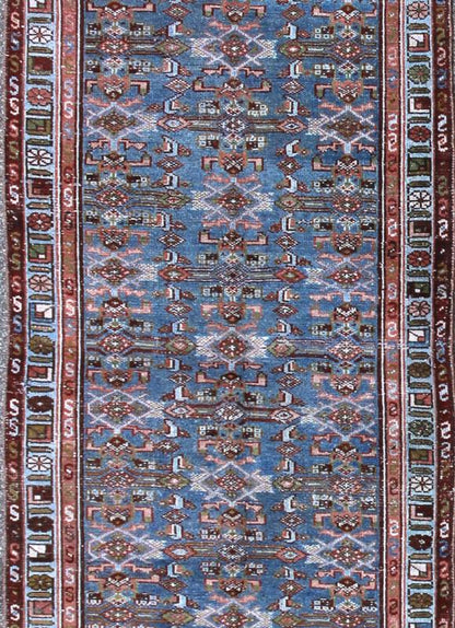 Early 20th Century Long Kurdish Runner with Blue, Red, Green and Salmon Pink kwarugs This antique Kurdish tribal runner was woven by Kurdish weavers in western Persia in the early 20th century. Often they used this repeating latch - hook design in... - Keivan Woven ArtsSUS - 229 - 8413Rug