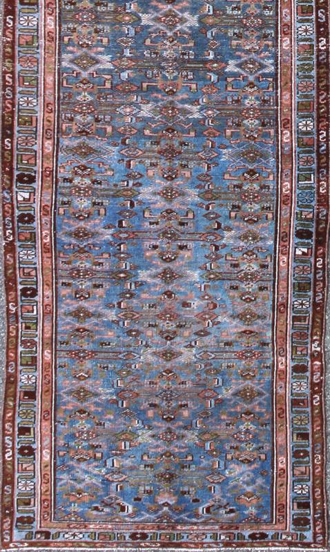 Early 20th Century Long Kurdish Runner with Blue, Red, Green and Salmon Pink kwarugs This antique Kurdish tribal runner was woven by Kurdish weavers in western Persia in the early 20th century. Often they used this repeating latch - hook design in... - Keivan Woven ArtsSUS - 229 - 8413Rug