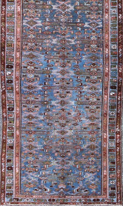 Early 20th Century Long Kurdish Runner with Blue, Red, Green and Salmon Pink kwarugs This antique Kurdish tribal runner was woven by Kurdish weavers in western Persia in the early 20th century. Often they used this repeating latch - hook design in... - Keivan Woven ArtsSUS - 229 - 8413Rug