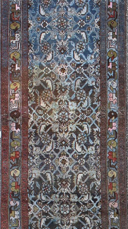 Early 20th Century Very Long Kurdish Runner with Dark/Light Blue, Red and Taupe kwarugs This Kurdish tribal rug was woven by Kurdish weavers in western Persia in the early 20th century. Often they used this repeating latch - hook design in the... - Keivan Woven ArtsSUS - 259 - 8421Rug