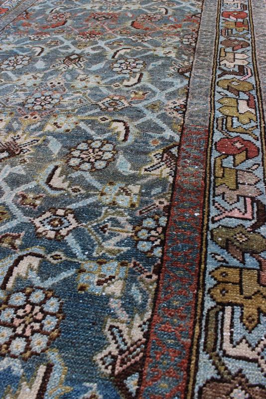 Early 20th Century Very Long Kurdish Runner with Dark/Light Blue, Red and Taupe kwarugs This Kurdish tribal rug was woven by Kurdish weavers in western Persia in the early 20th century. Often they used this repeating latch - hook design in the... - Keivan Woven ArtsSUS - 259 - 8421Rug