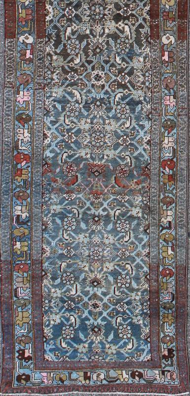 Early 20th Century Very Long Kurdish Runner with Dark/Light Blue, Red and Taupe kwarugs This Kurdish tribal rug was woven by Kurdish weavers in western Persia in the early 20th century. Often they used this repeating latch - hook design in the... - Keivan Woven ArtsSUS - 259 - 8421Rug