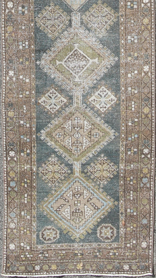 Heriz Antique Persian Rug with Multi - Layered Geometric Medallions in Blue, Brown, rug sus - 4702, country of origin / type: Iran / Heriz Serapi, circa 1900 This magnificent Heriz Serapi runner woven in the early 20th century bears an exquisite des... - Keivan Woven ArtsSUS - 4702 - 9132Rug
