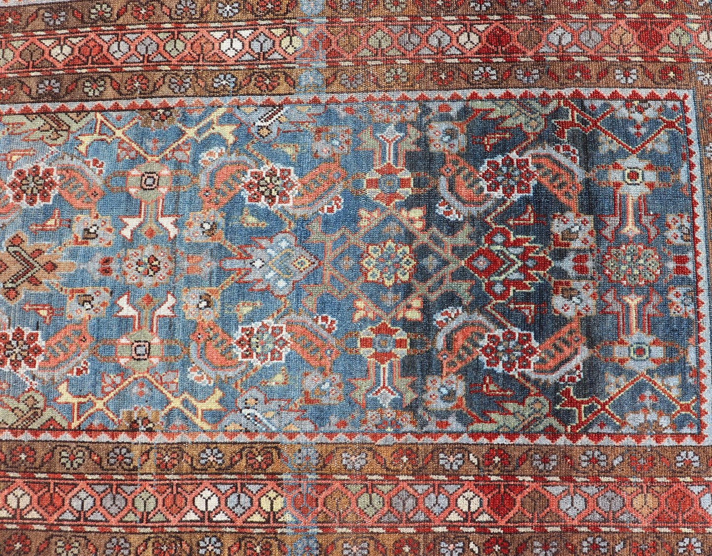 N.W. Persian Runner with Geometric Florals Set on a Deep Blue Field This Northwest Persian runner features a deep blue background flanked by multiple sand - colored and red borders. The elegant, all - over design in the field consists of a free - flow... - Keivan Woven ArtsSUS - 60 - 8395Rug