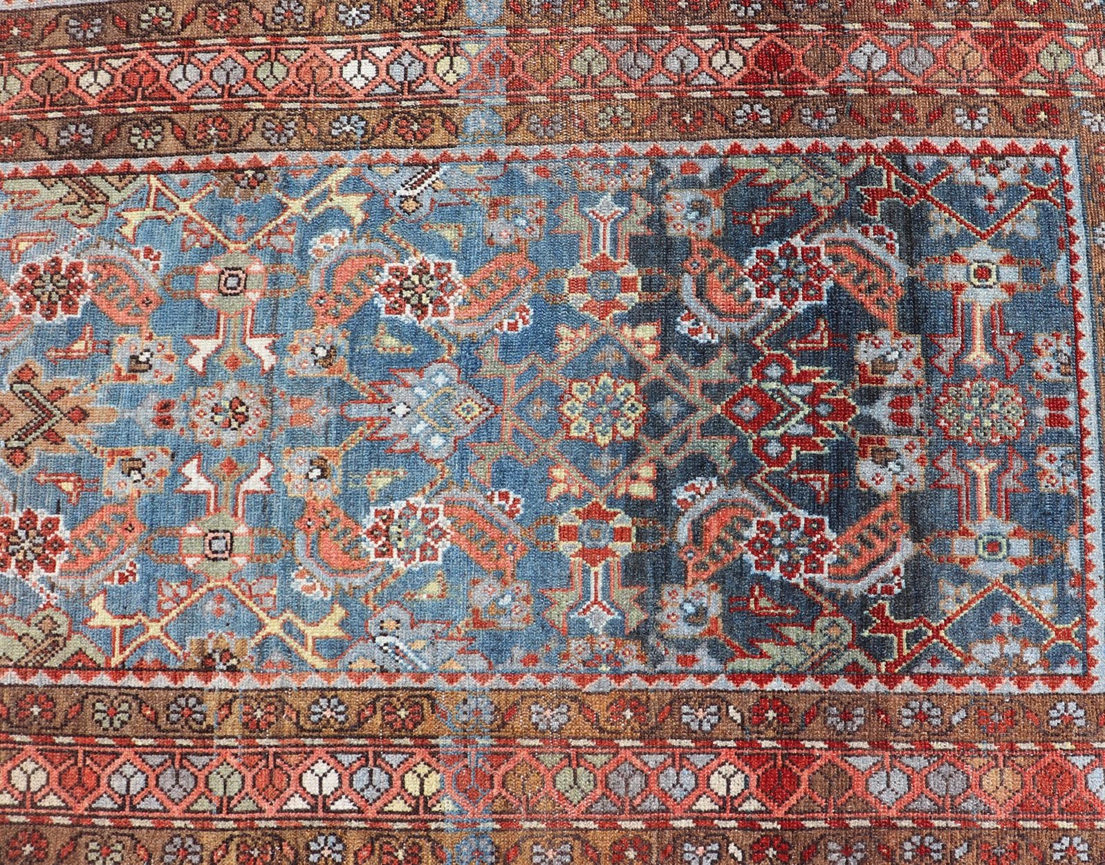N.W. Persian Runner with Geometric Florals Set on a Deep Blue Field This Northwest Persian runner features a deep blue background flanked by multiple sand - colored and red borders. The elegant, all - over design in the field consists of a free - flow... - Keivan Woven ArtsSUS - 60 - 8395Rug