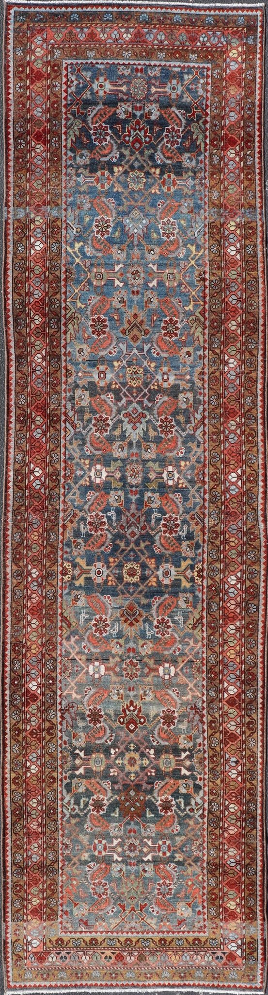 N.W. Persian Runner with Geometric Florals Set on a Deep Blue Field This Northwest Persian runner features a deep blue background flanked by multiple sand - colored and red borders. The elegant, all - over design in the field consists of a free - flow... - Keivan Woven ArtsSUS - 60 - 8395Rug