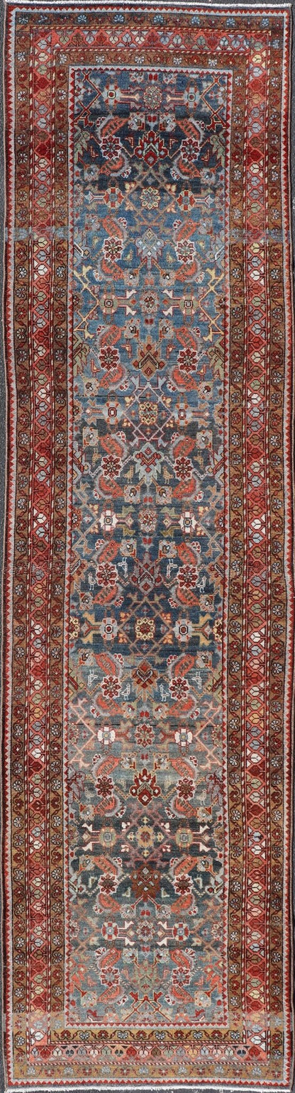N.W. Persian Runner with Geometric Florals Set on a Deep Blue Field This Northwest Persian runner features a deep blue background flanked by multiple sand - colored and red borders. The elegant, all - over design in the field consists of a free - flow... - Keivan Woven ArtsSUS - 60 - 8395Rug