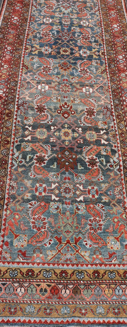 N.W. Persian Runner with Geometric Florals Set on a Deep Blue Field This Northwest Persian runner features a deep blue background flanked by multiple sand - colored and red borders. The elegant, all - over design in the field consists of a free - flow... - Keivan Woven ArtsSUS - 60 - 8395Rug