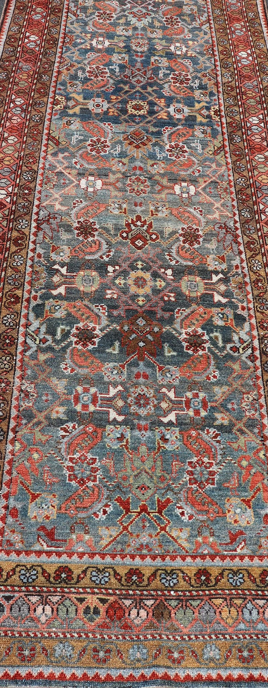 N.W. Persian Runner with Geometric Florals Set on a Deep Blue Field This Northwest Persian runner features a deep blue background flanked by multiple sand - colored and red borders. The elegant, all - over design in the field consists of a free - flow... - Keivan Woven ArtsSUS - 60 - 8395Rug