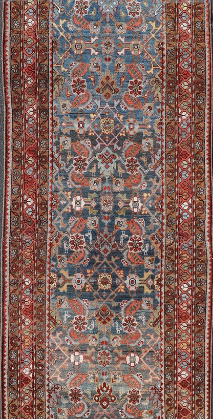 N.W. Persian Runner with Geometric Florals Set on a Deep Blue Field This Northwest Persian runner features a deep blue background flanked by multiple sand - colored and red borders. The elegant, all - over design in the field consists of a free - flow... - Keivan Woven ArtsSUS - 60 - 8395Rug