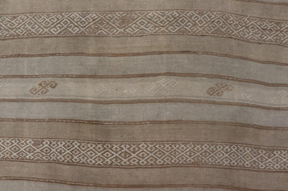 Vintage Turkish Kilim Rug with Subtle Earthy Tones and Intricate Geometric Patterns