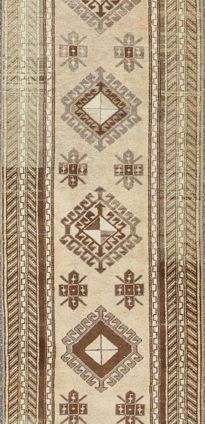 Earth - Toned Vintage Turkish Oushak Runner with Stacked Medallion Design. Light camel, brown, and taupe Oushak runner from Turkey with tribal geometric design, Keivan Woven Arts rug #TRA - 180401, country of origin / type: Turkey / Oushak, circa 1940. ... - Keivan Woven ArtsTRA - 180401 - 10217Rug