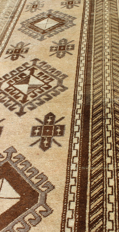 Earth - Toned Vintage Turkish Oushak Runner with Stacked Medallion Design. Light camel, brown, and taupe Oushak runner from Turkey with tribal geometric design, Keivan Woven Arts rug #TRA - 180401, country of origin / type: Turkey / Oushak, circa 1940. ... - Keivan Woven ArtsTRA - 180401 - 10217Rug