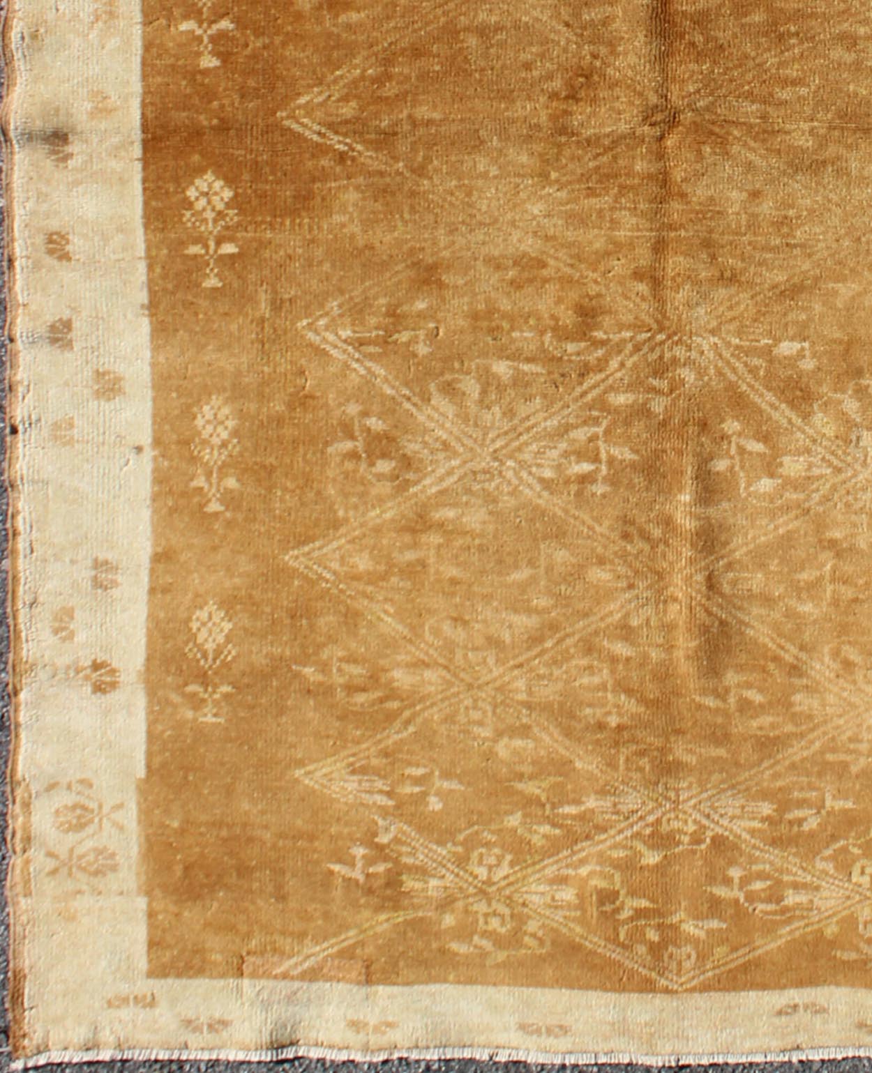 Light Brown Vintage Turkish Rug with Lattice Pattern in Light Brown and Ivory, rug tu - 9501, country of origin / type: Turkey / Oushak, circa mid - 20th century Set on a light brown field with a latticework floral pattern, this beautiful vintage Ou... - Keivan Woven ArtsTU - 9501 - 1682Rug