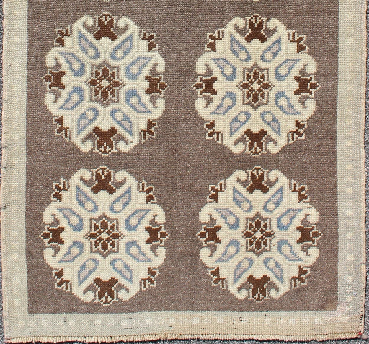 Tribal Turkish Oushak Carpet with Floral Medallions in Taupe, Ivory and Blue Measures: 2'9'' x 6'4''. This Turkish Oushak gallery rug features ten floral medallions that take center stage on a brown field. The border reveals tribal inspiratio... - Keivan Woven ArtsTU - ALK - 3562 - 6787Rug