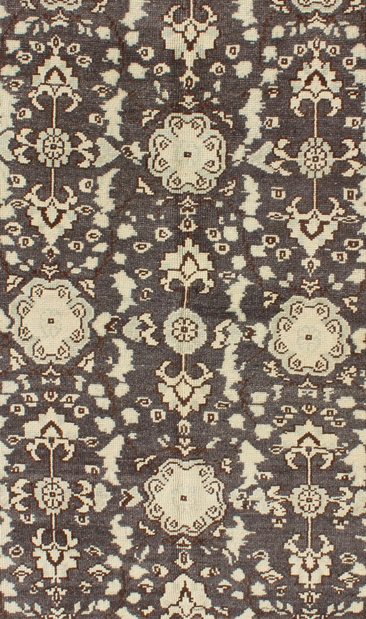 Vintage Turkish Oushak Area Rug in Dark Charcoal, Brown, and Ivory Measures: 3'9 x 5'10 This vintage Oushak was hand - knotted in Turkey during the 1940's. The dark brown field displays clover motifs and other nature designs in antique white ... - Keivan Woven ArtsTU - ALK - 3567 - 6805Rug