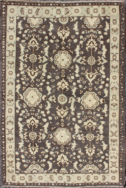 Vintage Turkish Oushak Area Rug in Dark Charcoal, Brown, and Ivory Measures: 3'9 x 5'10 This vintage Oushak was hand - knotted in Turkey during the 1940's. The dark brown field displays clover motifs and other nature designs in antique white ... - Keivan Woven ArtsTU - ALK - 3567 - 6805Rug