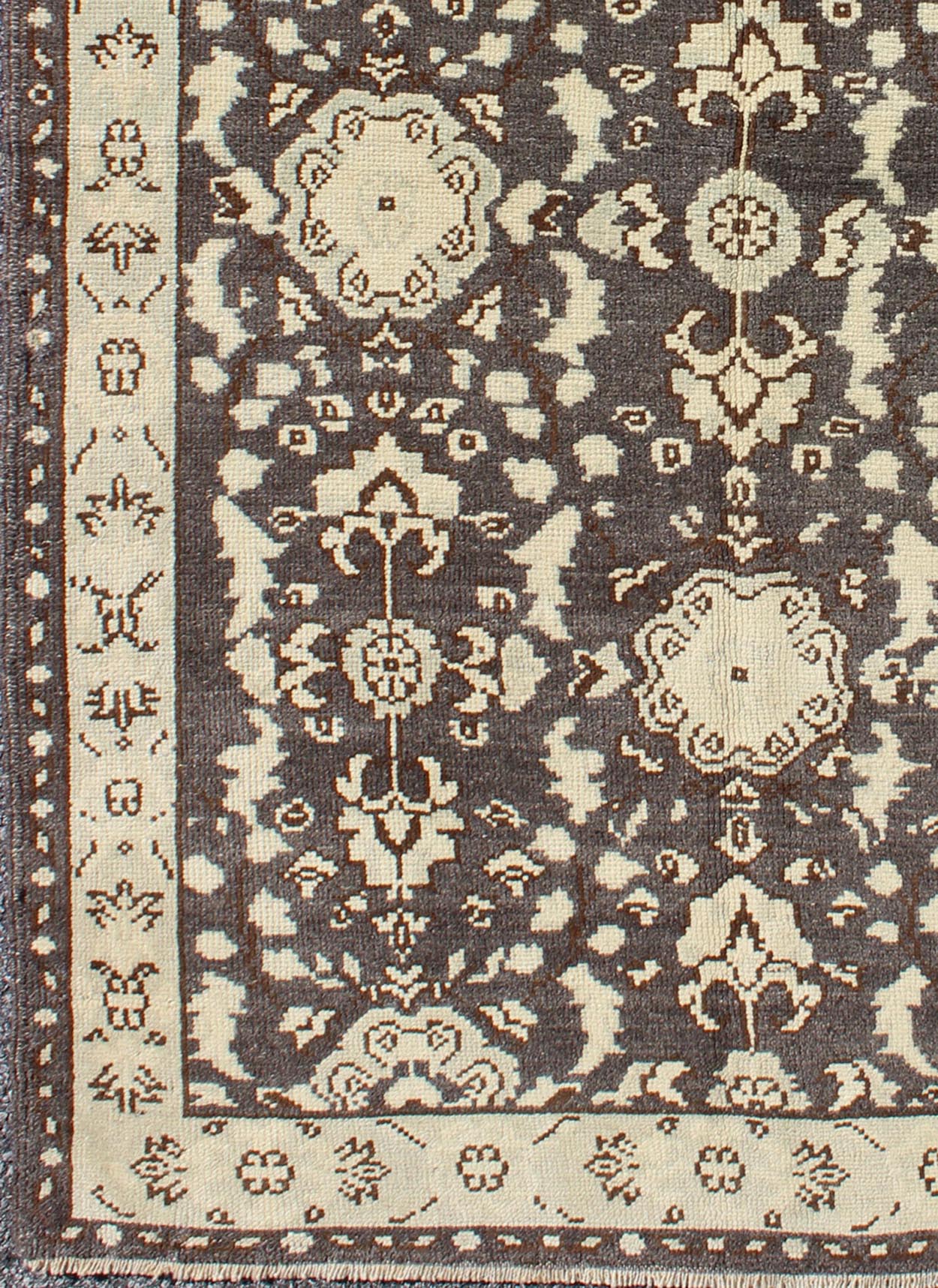 Vintage Turkish Oushak Area Rug in Dark Charcoal, Brown, and Ivory Measures: 3'9 x 5'10 This vintage Oushak was hand - knotted in Turkey during the 1940's. The dark brown field displays clover motifs and other nature designs in antique white ... - Keivan Woven ArtsTU - ALK - 3567 - 6805Rug