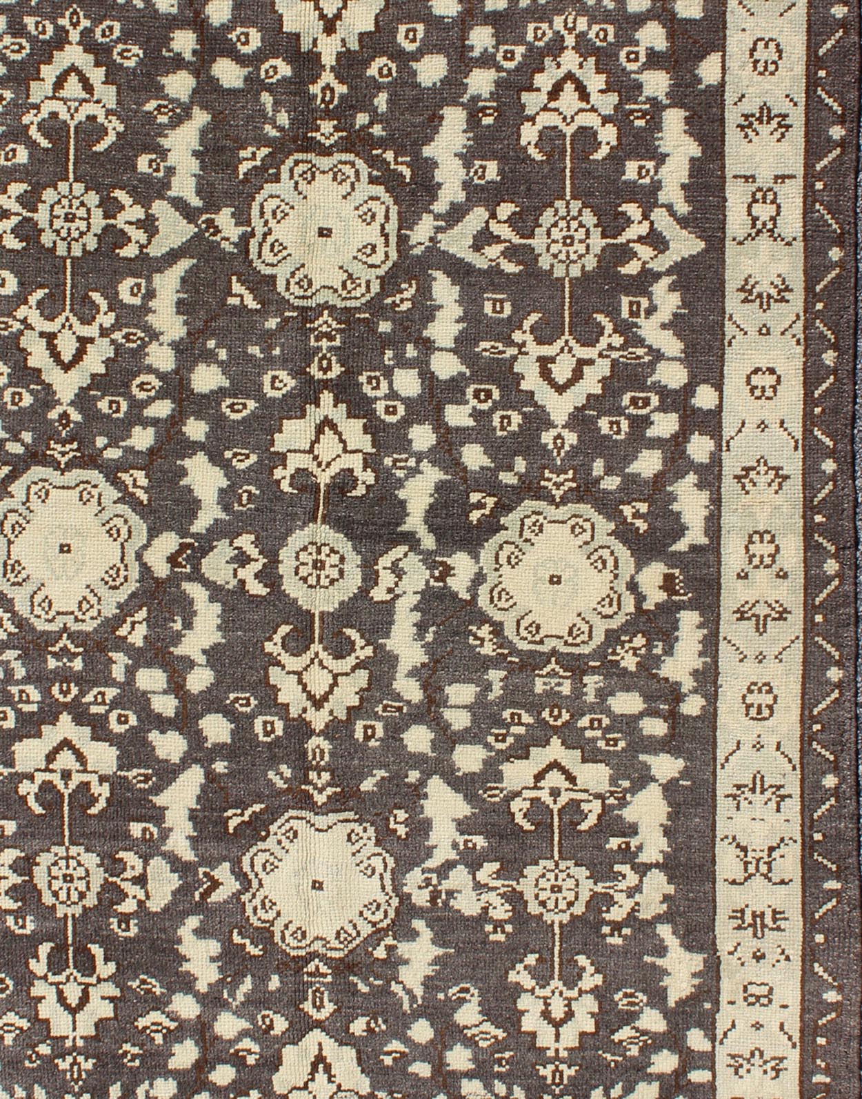 Vintage Turkish Oushak Area Rug in Dark Charcoal, Brown, and Ivory Measures: 3'9 x 5'10 This vintage Oushak was hand - knotted in Turkey during the 1940's. The dark brown field displays clover motifs and other nature designs in antique white ... - Keivan Woven ArtsTU - ALK - 3567 - 6805Rug