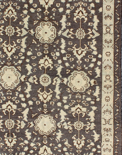 Vintage Turkish Oushak Area Rug in Dark Charcoal, Brown, and Ivory Measures: 3'9 x 5'10 This vintage Oushak was hand - knotted in Turkey during the 1940's. The dark brown field displays clover motifs and other nature designs in antique white ... - Keivan Woven ArtsTU - ALK - 3567 - 6805Rug