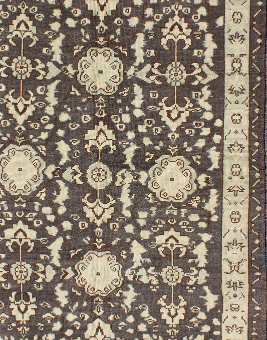 Vintage Turkish Oushak Area Rug in Dark Charcoal, Brown, and Ivory Measures: 3'9 x 5'10 This vintage Oushak was hand - knotted in Turkey during the 1940's. The dark brown field displays clover motifs and other nature designs in antique white ... - Keivan Woven ArtsTU - ALK - 3567 - 6805Rug