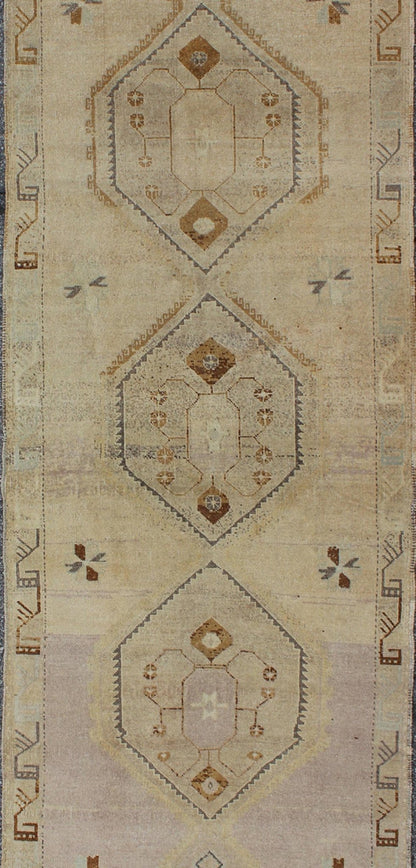 Vintage Turkish Oushak Runner with Tribal Medallions in Lavender, Taupe & Brown This vintage Turkish Oushak gallery rug (circa mid - 20th century) features a unique blend of colors and an intricately beautiful design. The central medallions consis... - Keivan Woven ArtsTU - ALK - 3581 - 6779Rug