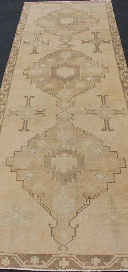 Vintage Turkish Oushak Runner Neutral and warm Colors with Tribal Medallions. wide and long vintage Turkish Oushak runner in neutral colors with medallions in taupe, blue and light brown. rug/TU - ALK - 4873. Vintage Oushak runner This vintage Ousha... - Keivan Woven ArtsTU - ALK - 4873 - 12126Rug
