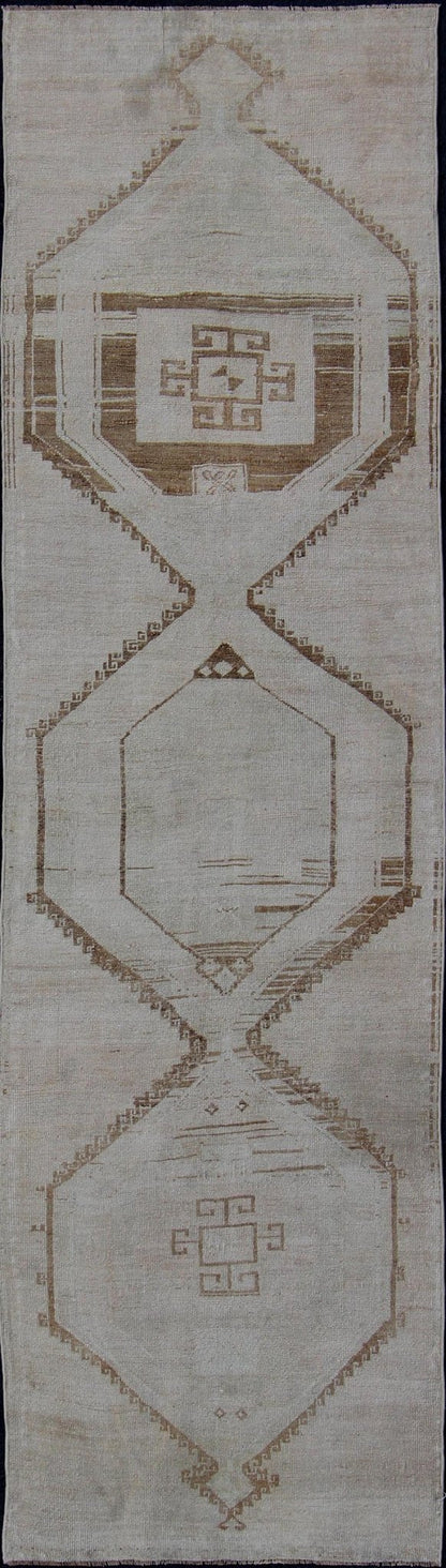 Vintage Turkish Geometric Oushak Runner with Medallions in Taupe and Brown Tri Medallion Oushak runner, rug tu - alk - 4897, country of origin / type: Turkey / Oushak, circa 1940 This Oushak carpet from mid - 20th century Turkey features a st... - Keivan Woven ArtsTU - ALK - 4897 - 10852Rug
