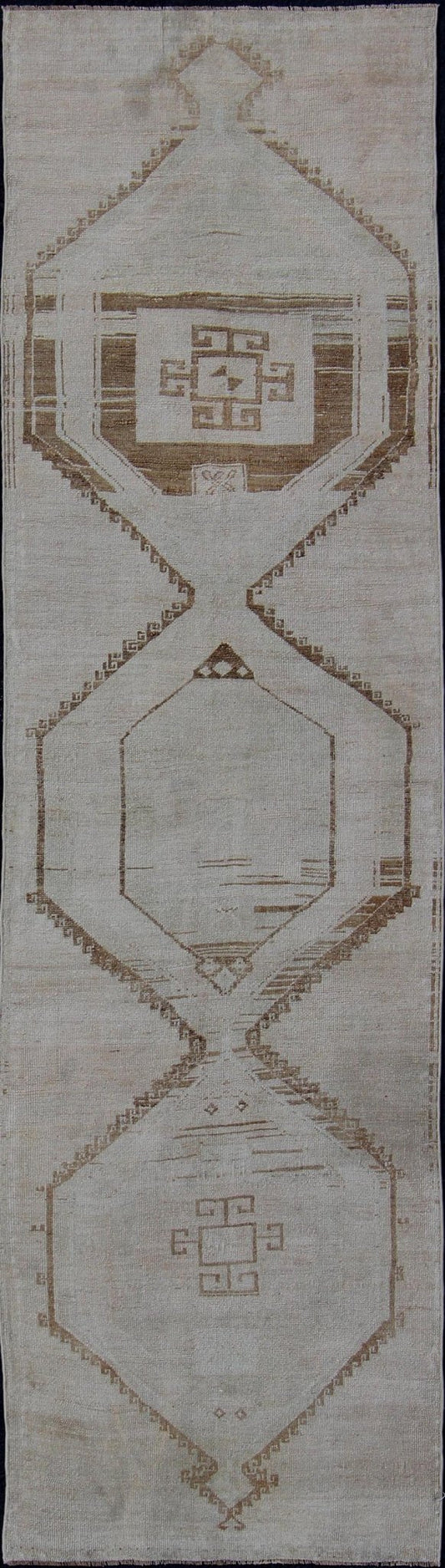 Vintage Turkish Geometric Oushak Runner with Medallions in Taupe and Brown Tri Medallion Oushak runner, rug tu - alk - 4897, country of origin / type: Turkey / Oushak, circa 1940 This Oushak carpet from mid - 20th century Turkey features a st... - Keivan Woven ArtsTU - ALK - 4897 - 10852Rug