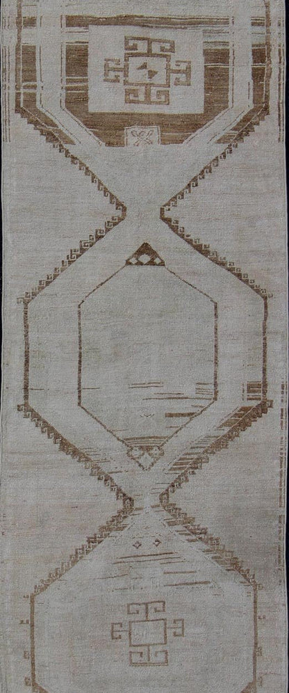 Vintage Turkish Geometric Oushak Runner with Medallions in Taupe and Brown Tri Medallion Oushak runner, rug tu - alk - 4897, country of origin / type: Turkey / Oushak, circa 1940 This Oushak carpet from mid - 20th century Turkey features a st... - Keivan Woven ArtsTU - ALK - 4897 - 10852Rug